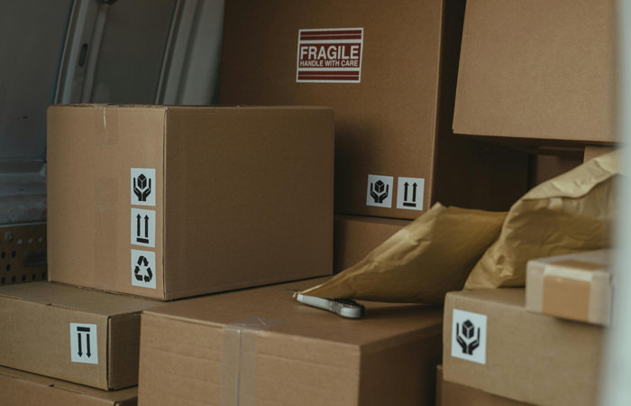 Small Business Moving Boxes in Van Boxes Packed Inside Transport Van for Small Business Moving – Efficient Delivery Services