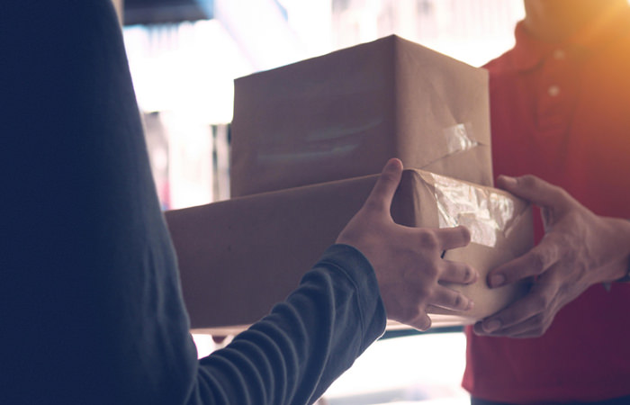 Secure Package Handoff to Customer Courier Handing Package to Customer – Efficient Delivery Services